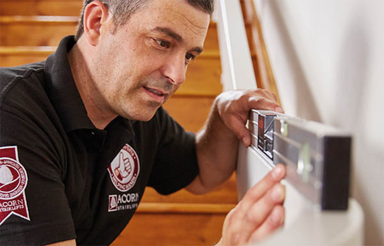 Stairlift Technician Measure Staircase Rail for Stairlift